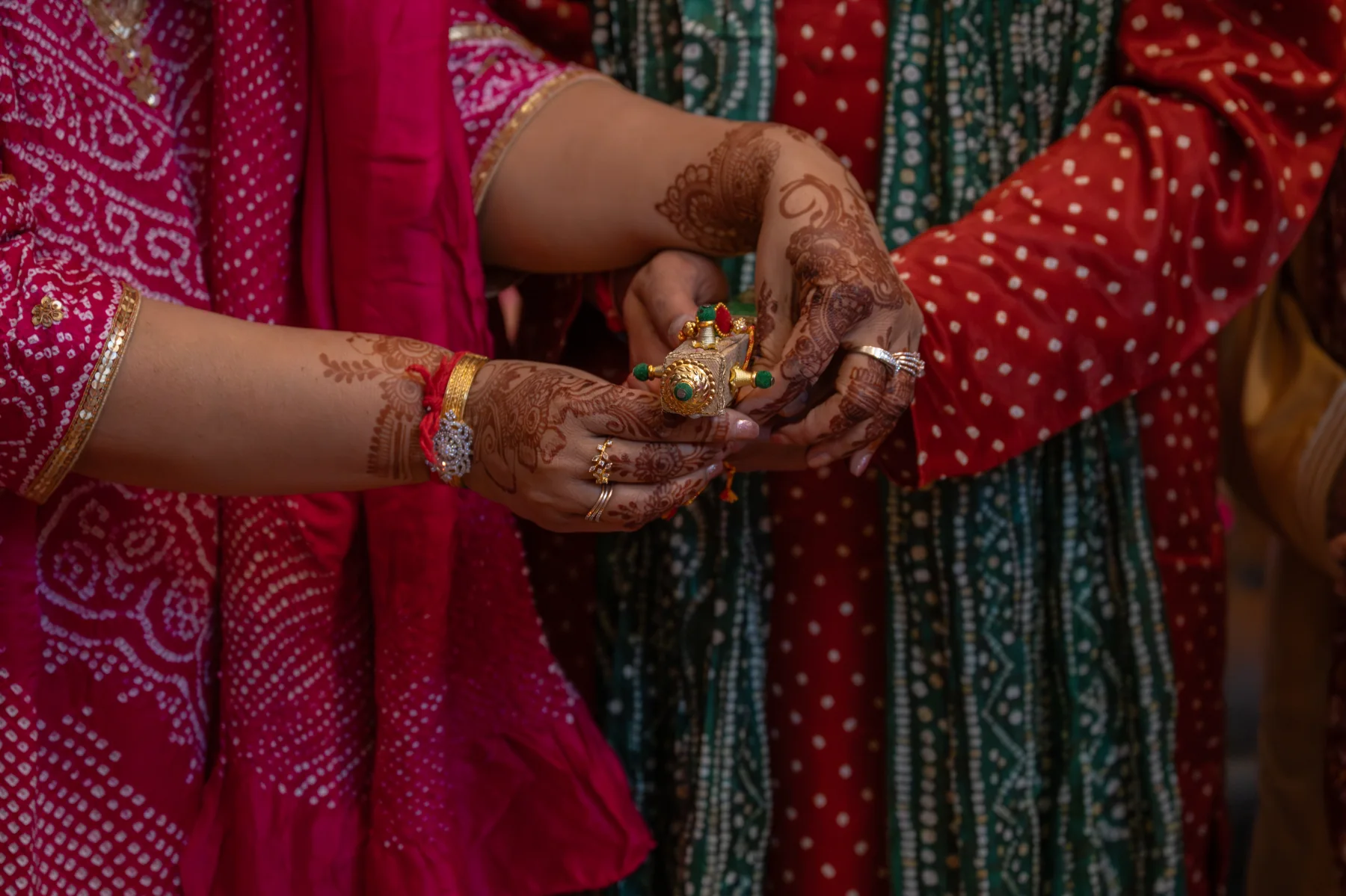 Decorated hands held together during a celebration