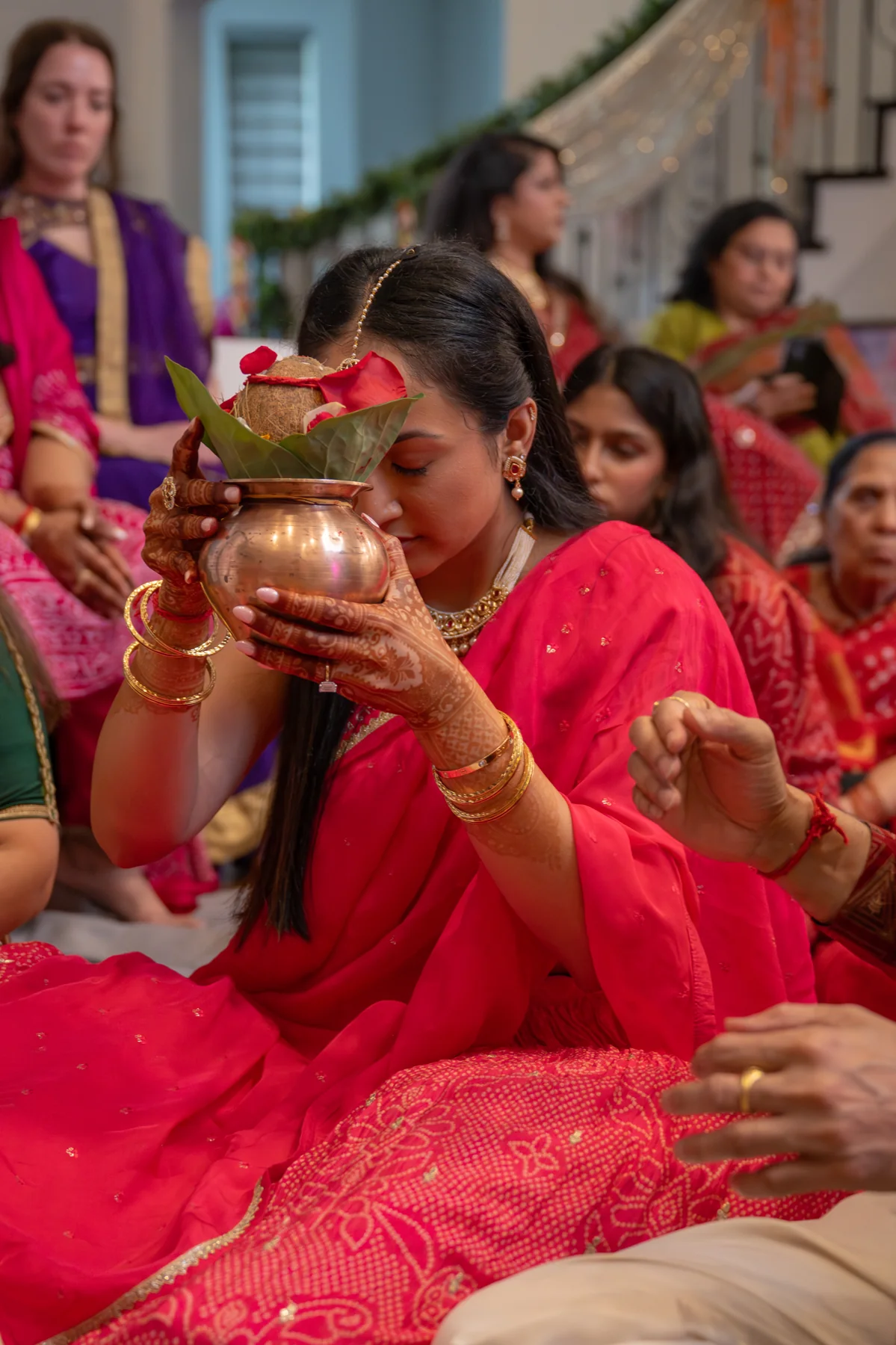 A person carrying a decorated vessel during a celebration
