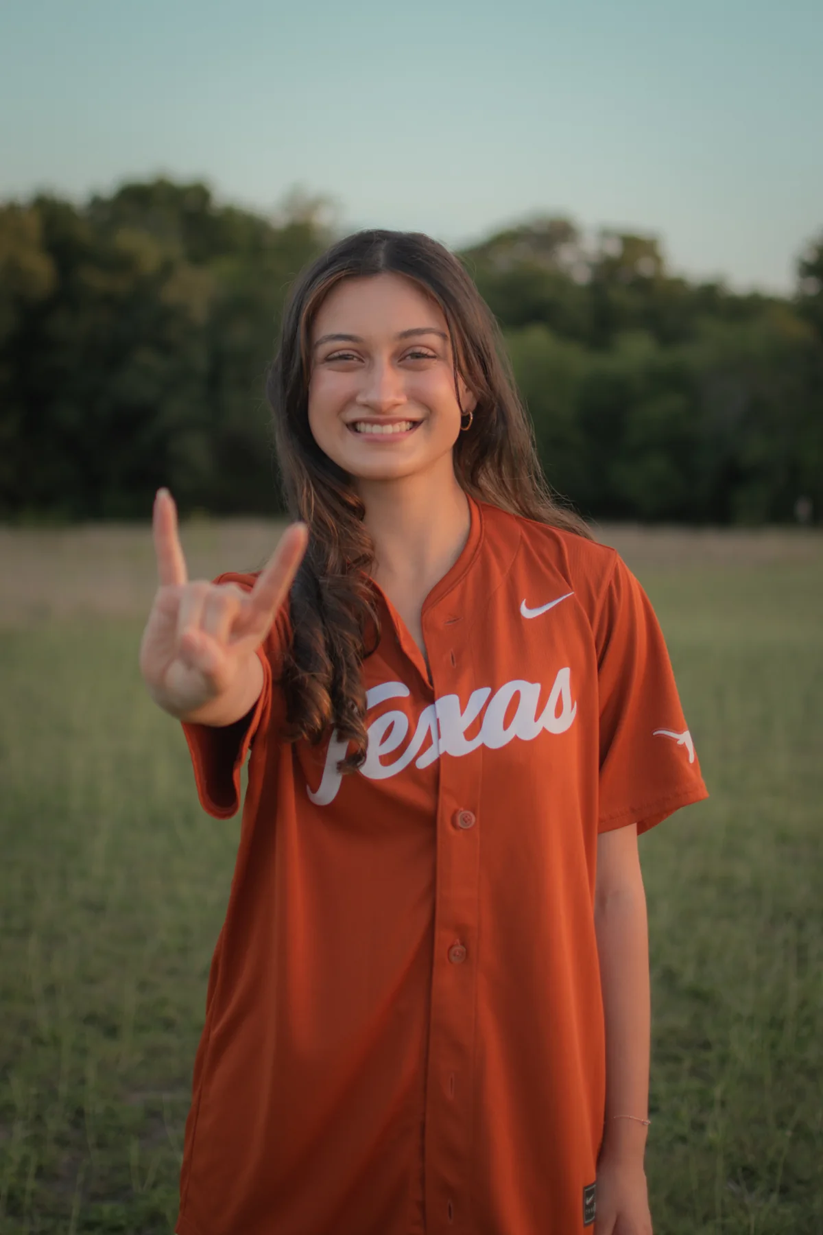 Portrait in an orange Texas shirt in evening light